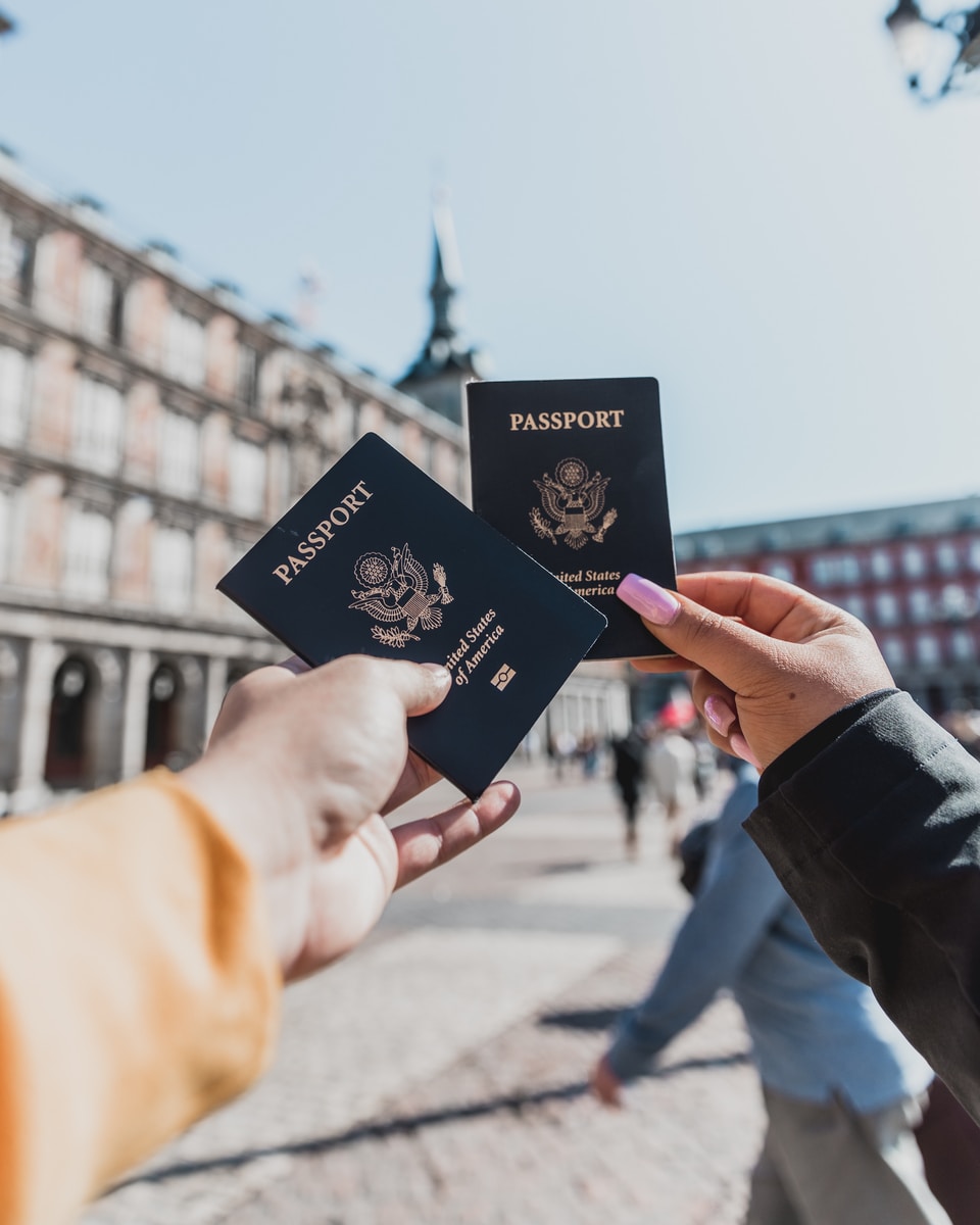 person holding passports