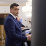 ost general SIE, dezvoltator al blocului în care locuiește George Simion.