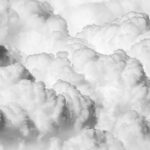 a black and white photo of clouds in the sky