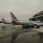 a couple of airplanes that are on a runway
