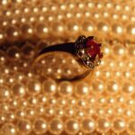 silver and red gemstone ring