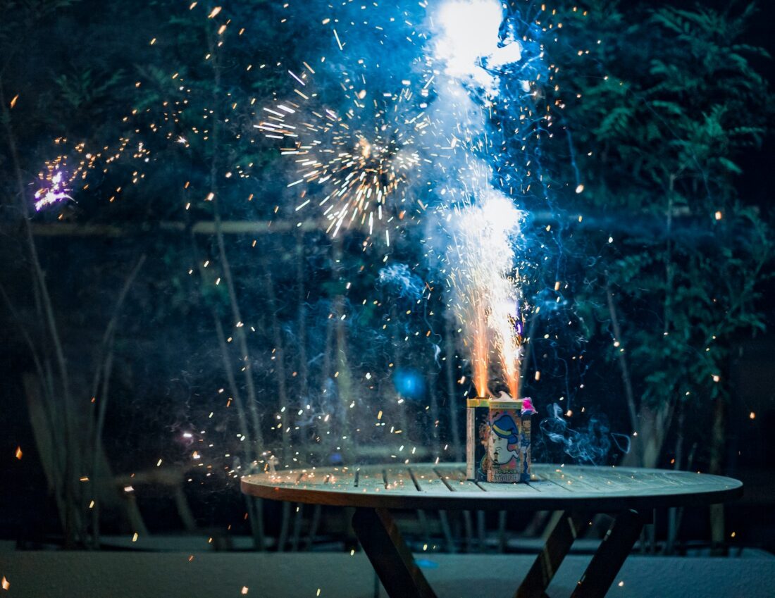 fireworks display on brown wooden table