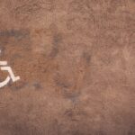 a handicap sign painted on the side of a wall