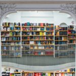 books on white wooden shelf