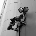 a security camera attached to the side of a building