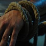 person wearing silver ring and silver ring